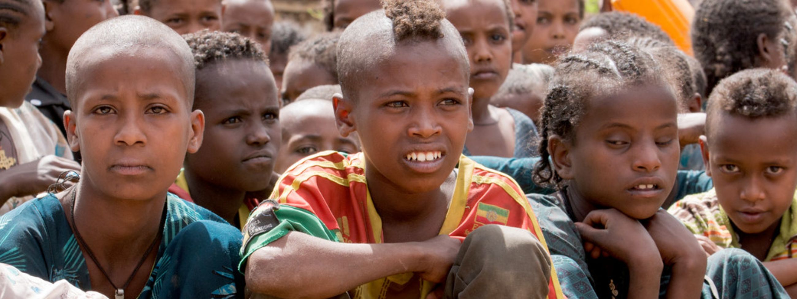 Sherifa, 8, who has cerebral palsy, receives support from CBM partner Saint John of God rehabilitation technician Clement Mkhomanya.