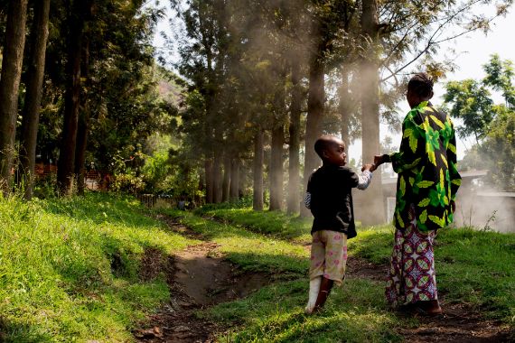A child walking with his mother