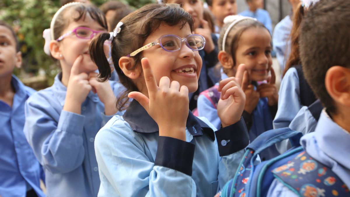Alma ( aged 10) learning sign language at ASDC.