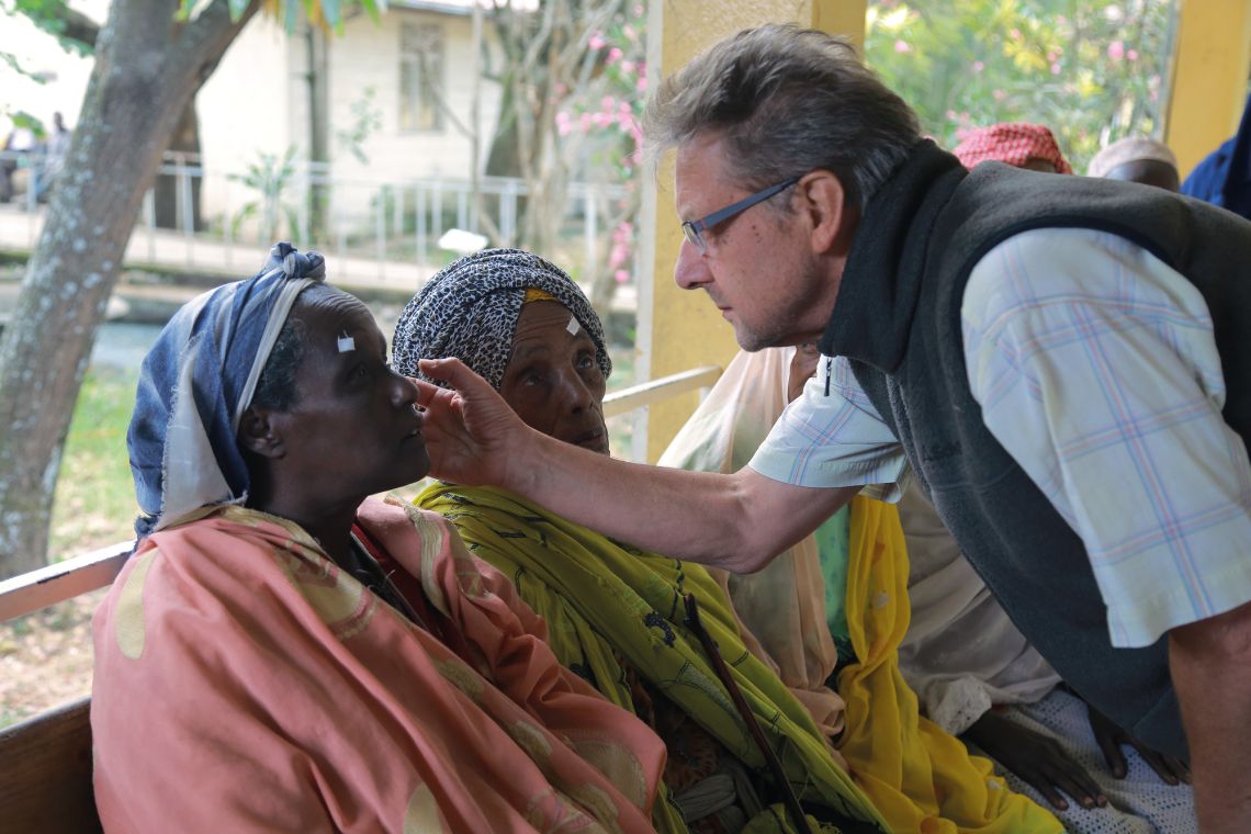 A doctor examining a patients eyes