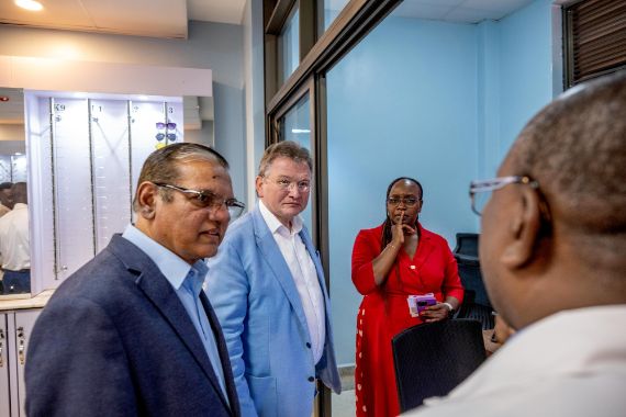 Four people meeting in a room