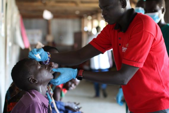 Eye-patch-removal and post-surgery-examination: The CBM programme officer takes off the bandages from the Young patient and cleans the wounds. Then he administers eyedrops. 